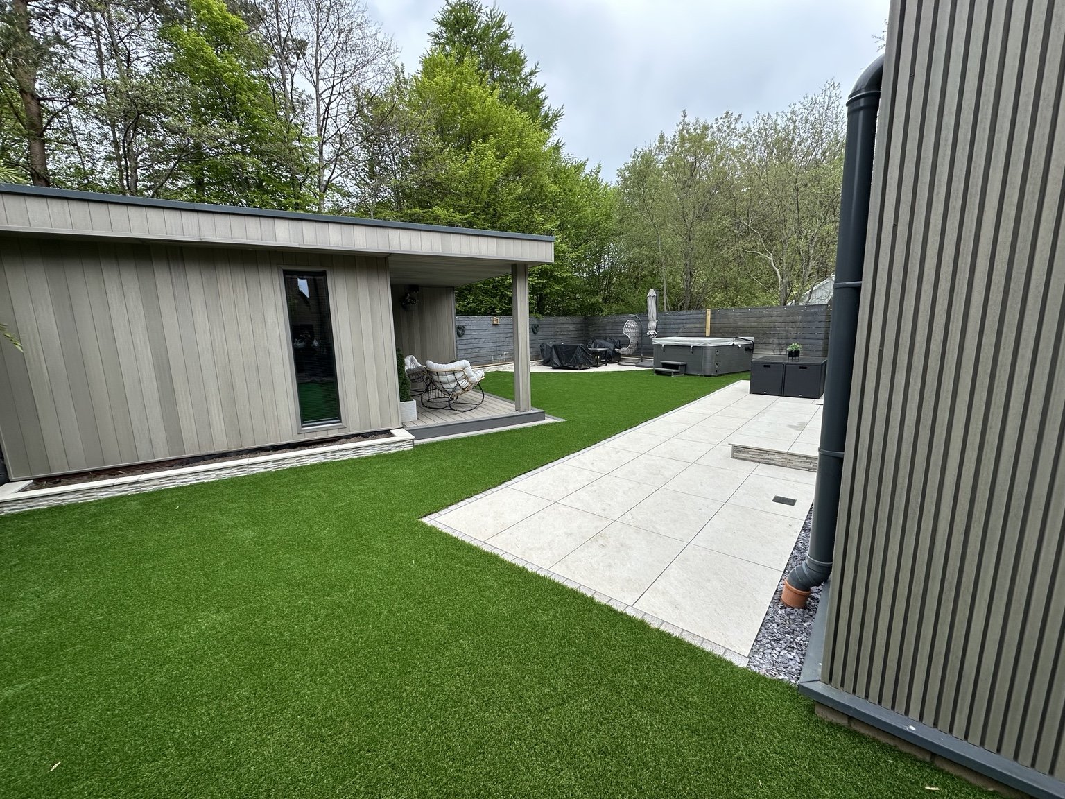 CLEO garden transformation with porcelain patio, lawn and outdoor seating