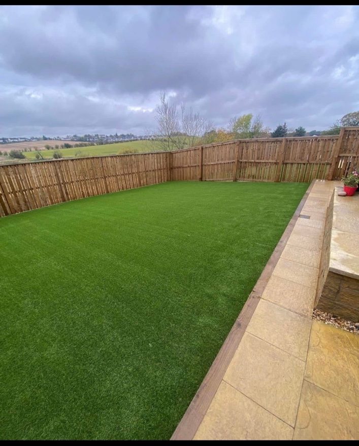 Finished garden with a large lawn and paving